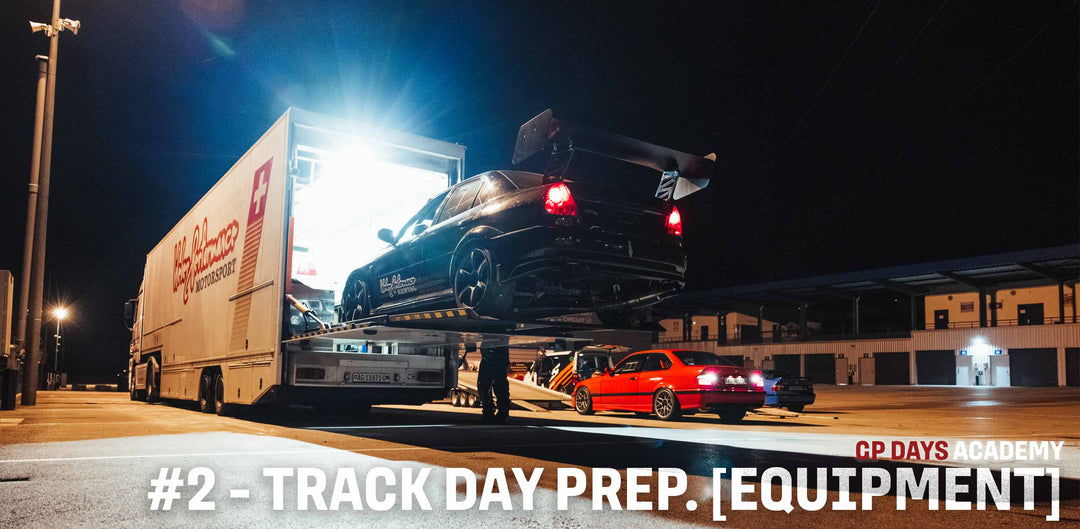 Mitsubishi Lancer Evo is  being unloaded from a trailer during a GP Days Open Pitlane Track Day